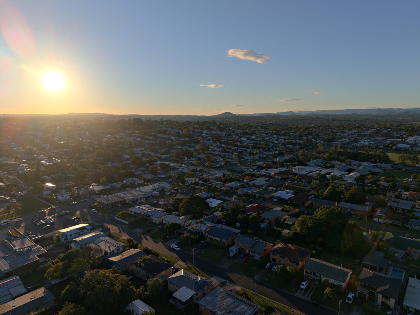 Aerial golden-hour view over an Ipswich residential suburb